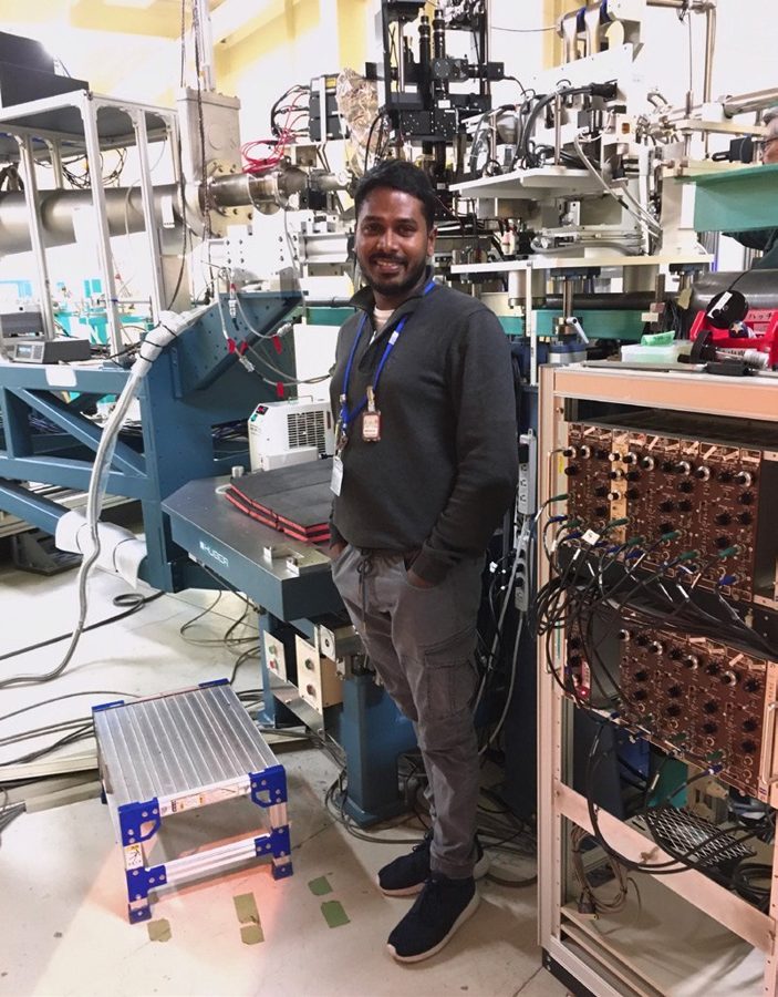 Sumith beside the six-ram press at the J-PARC neutron beamline