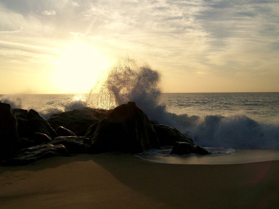 Sunrise over waves